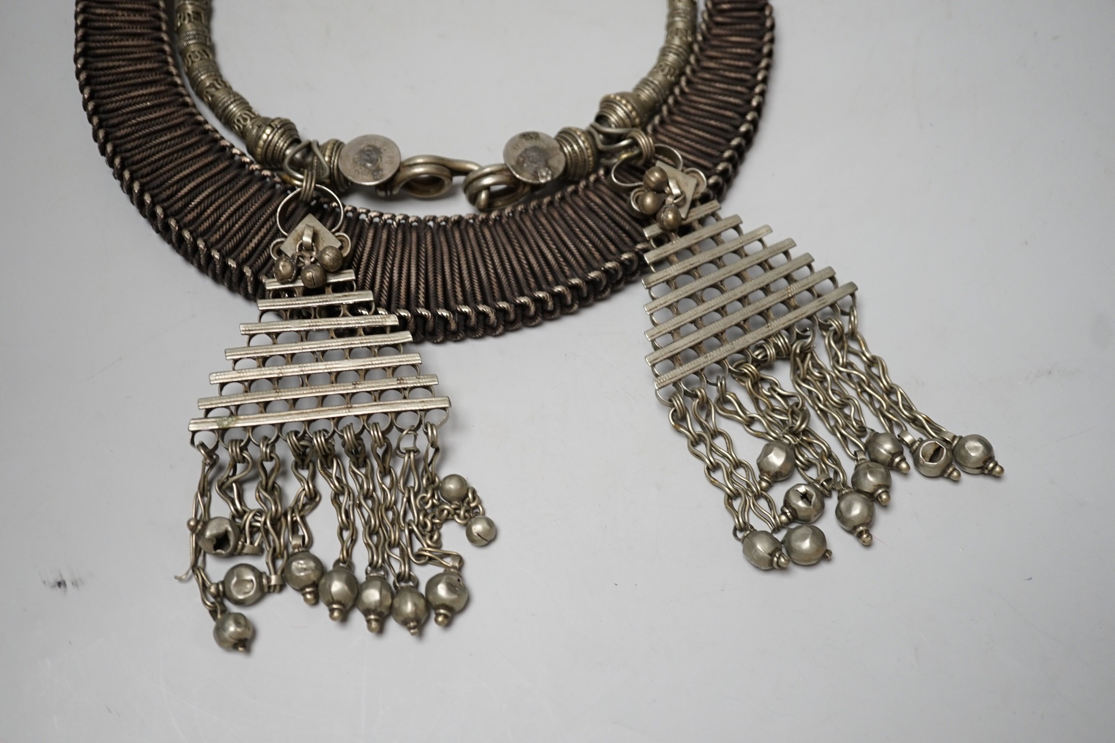 A Chinese Miao Hmong white metal wirework necklace and an Indian necklace